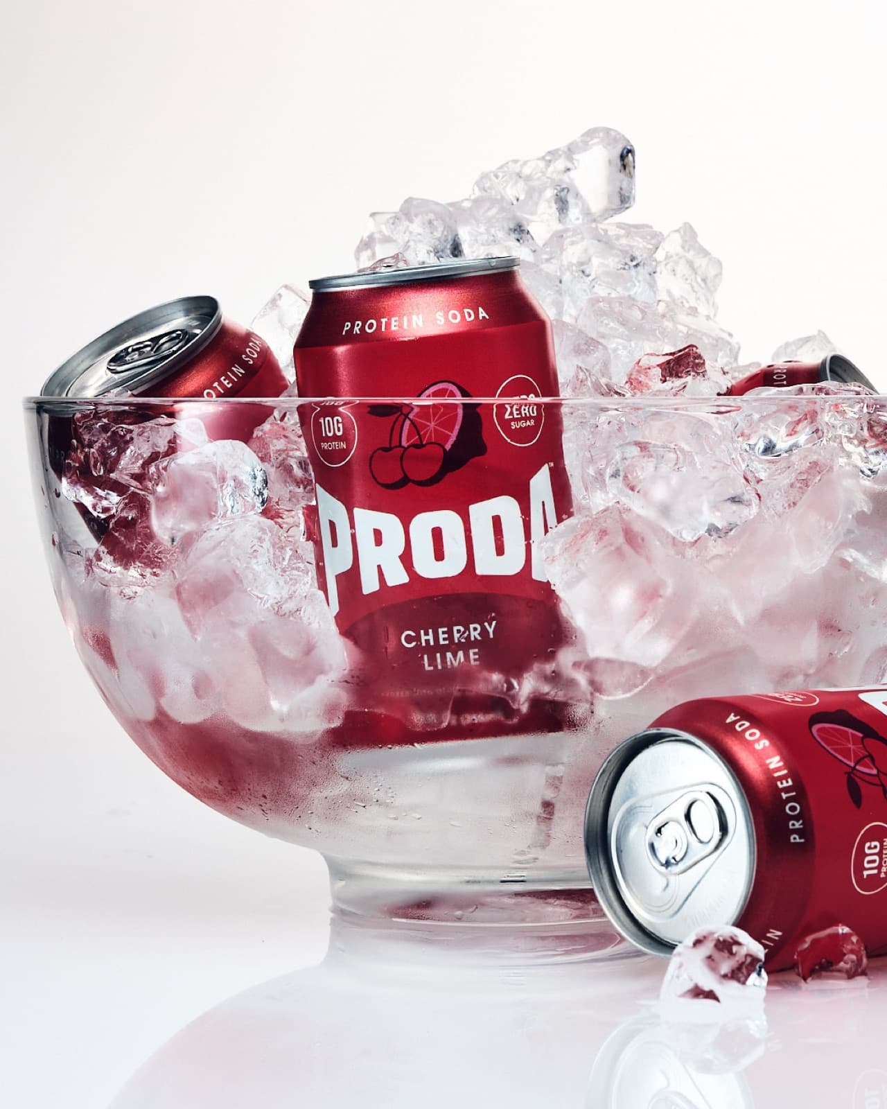 PRODA Cherry Lime cans buried in crushed ice in a glass bowl